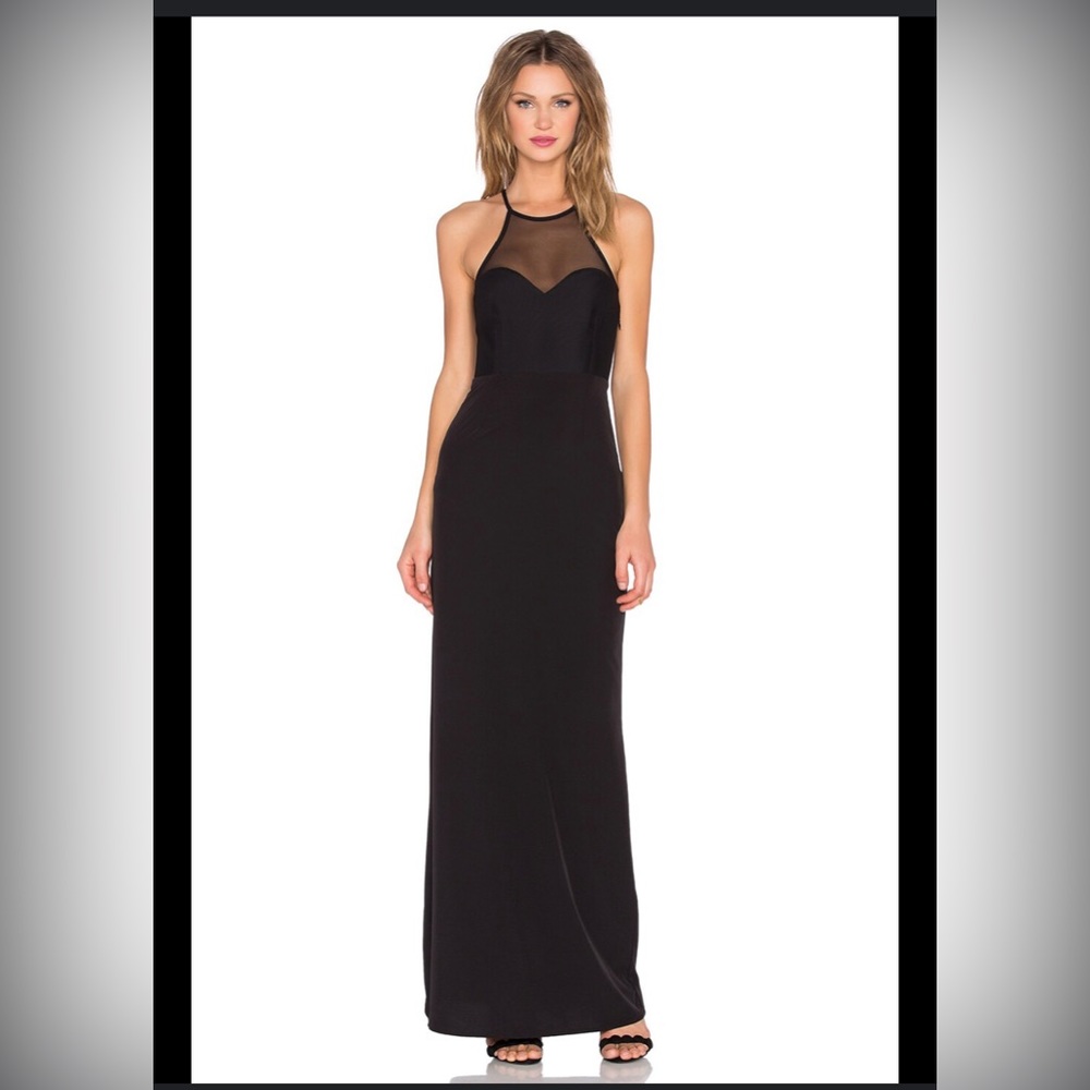 Worn once. Cleaned. Perfect condition. Gorgeous fitted black gown/dress.